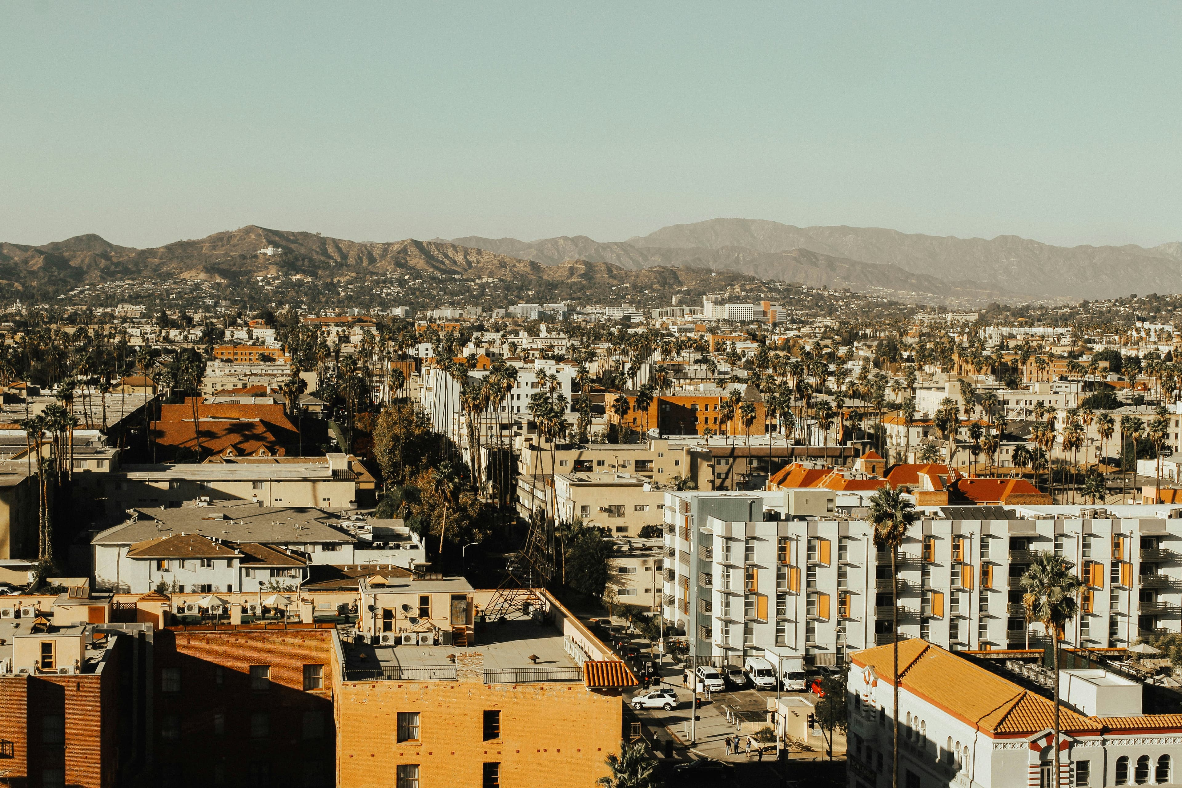 High-angle view of dense Koreatown Los Angeles apartment buildings and palm trees, illustrating the Koreatown real estate investment thesis